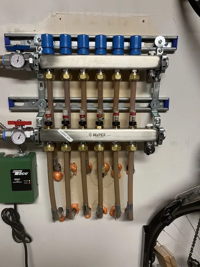 Plumber performing Water Heater Repair at a residential property in Applewood